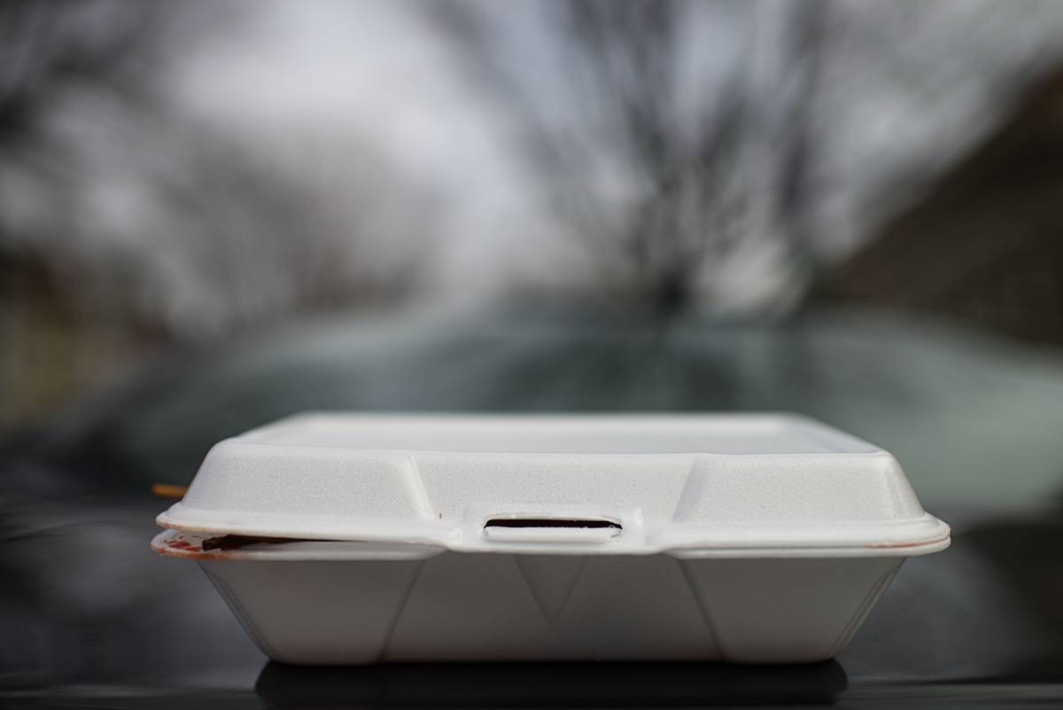 A styrofoam container holds leftovers from restaurants.