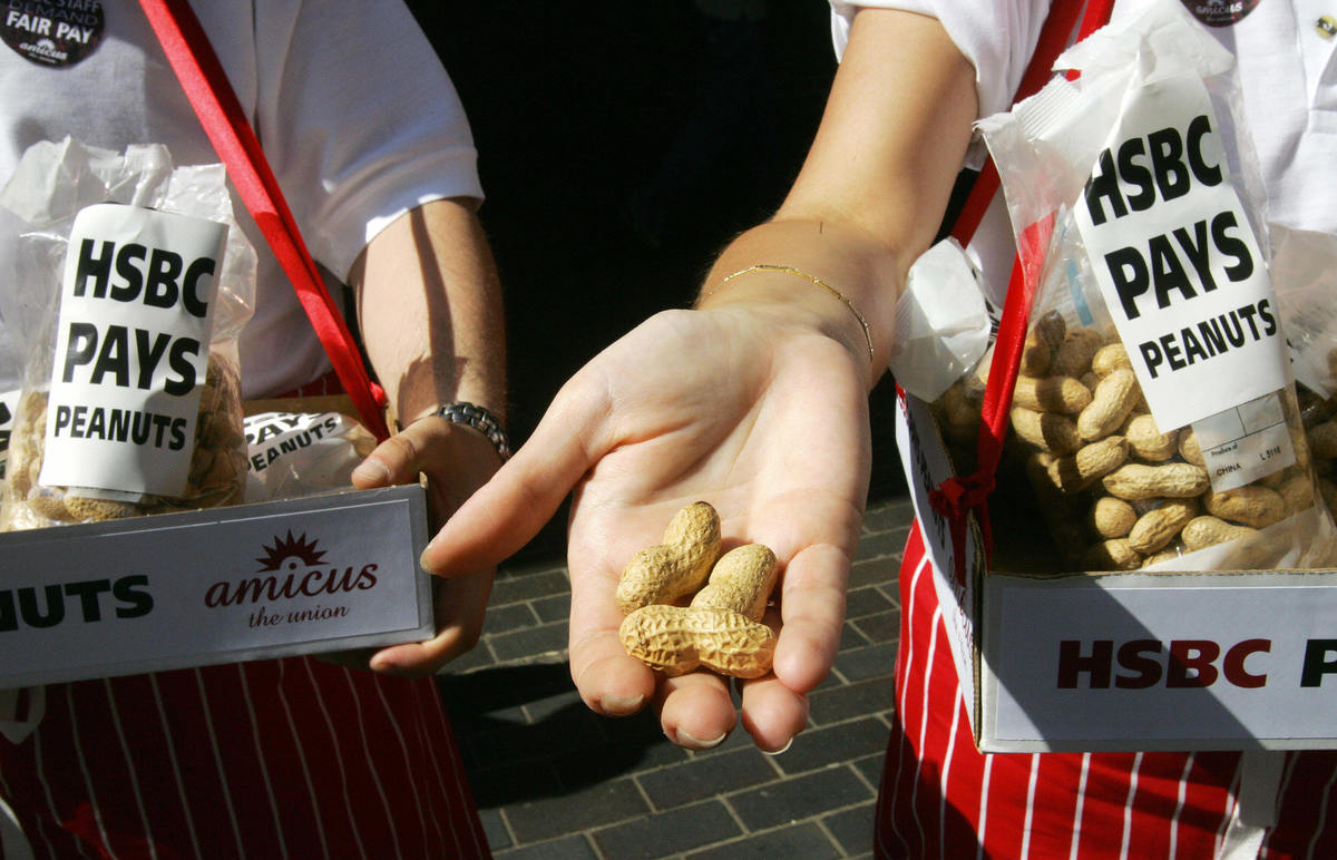 Employees offer peanuts to people.